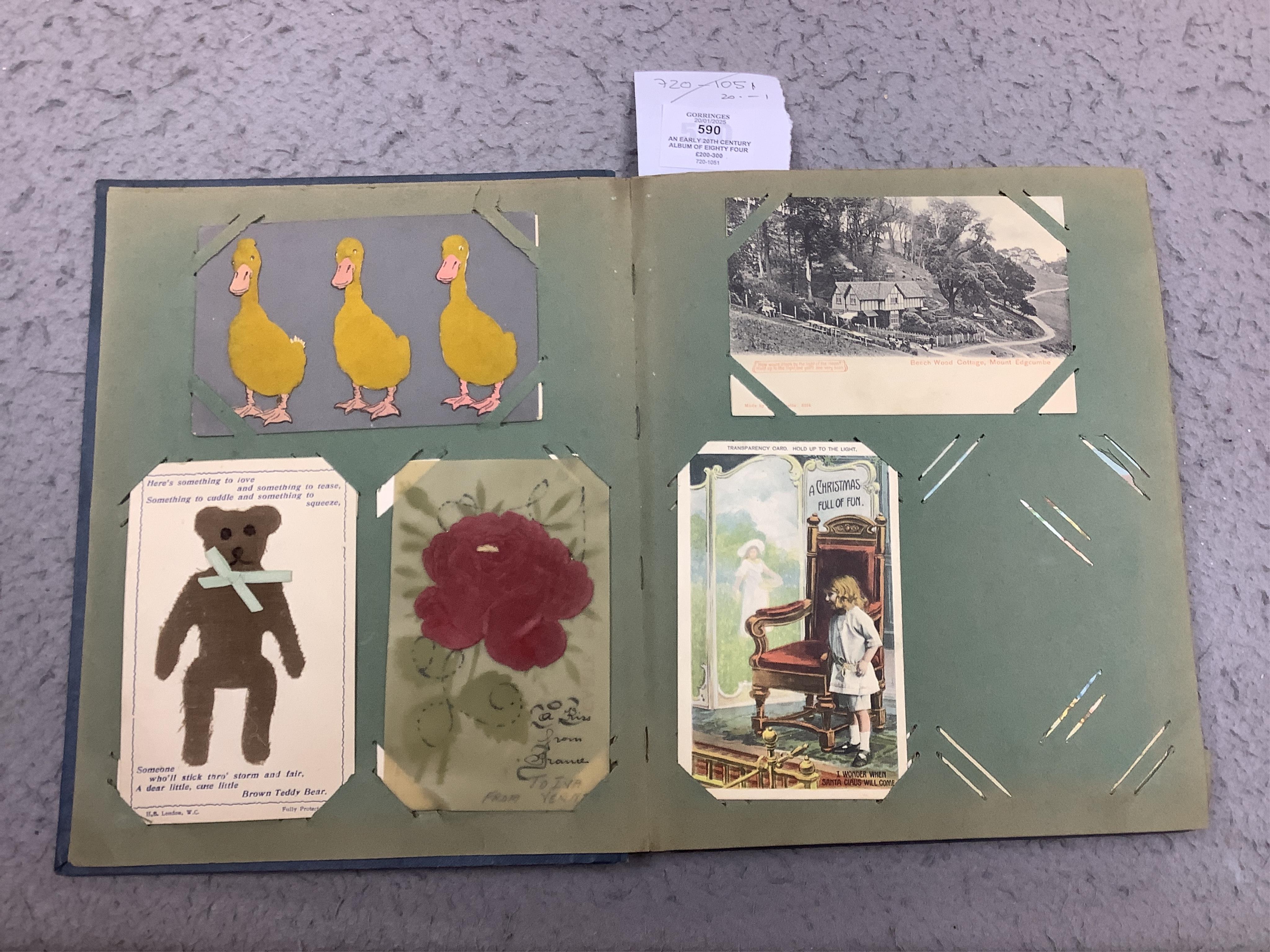 An early 20th century album of eighty four postcards; good selection including mechanical, silks, novelty, etc. Condition - variable